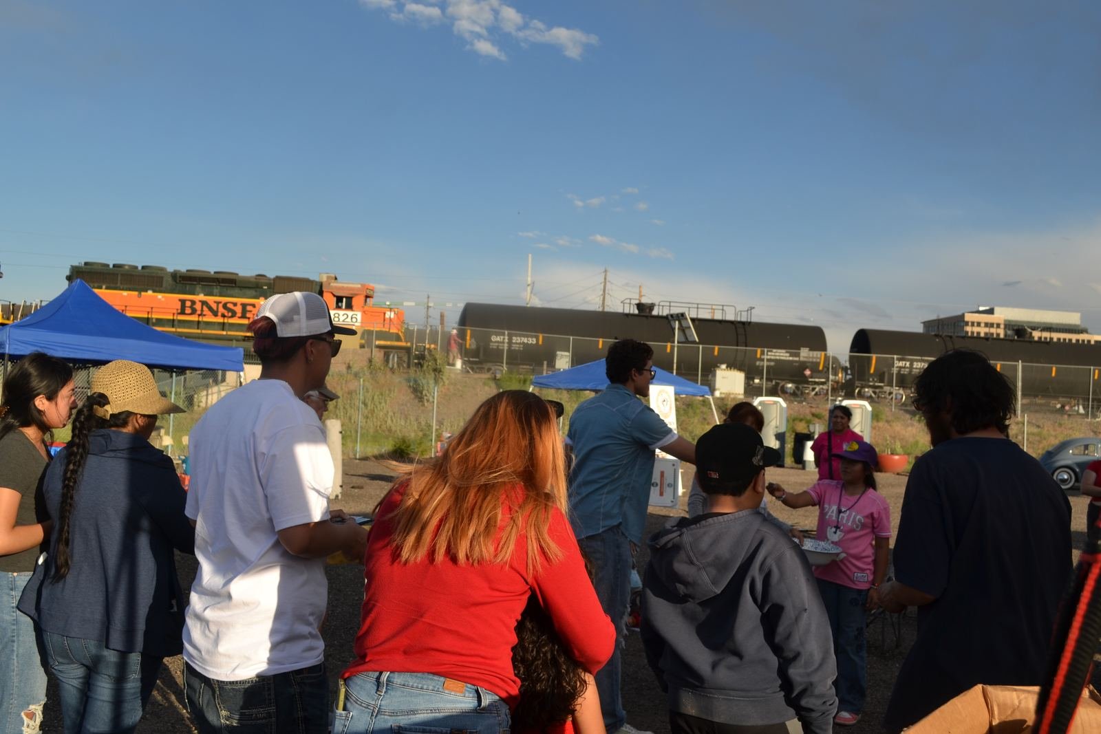 Families at La Fresca Fest with GES neighborhood in the background